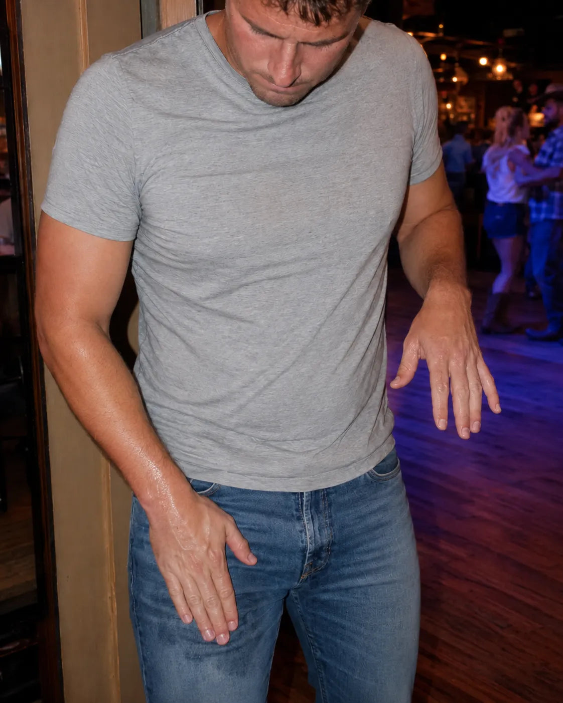 wiping sweaty hands on jeans at the bar